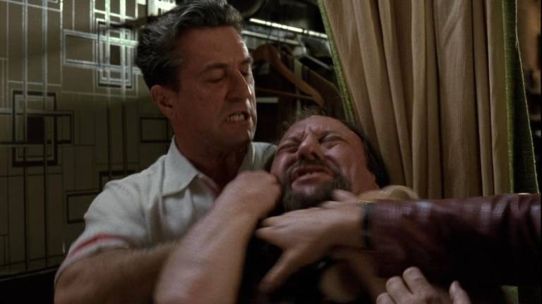 De Niro as Jimmy Conway in Goodfellas strangles Morrie, of Morrie’s Wigs, as Ray Liotta (Henry Hill) tries to intervene.