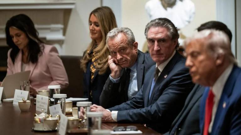 Health and Human Services Secretary Robert F. Kennedy, Jr. (center) joins President Donald Trump at a Cabinet meeting in the White House, April 10.