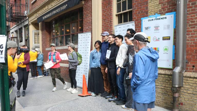 Participants pose with their certificates of completion at Fraunces Tavern.