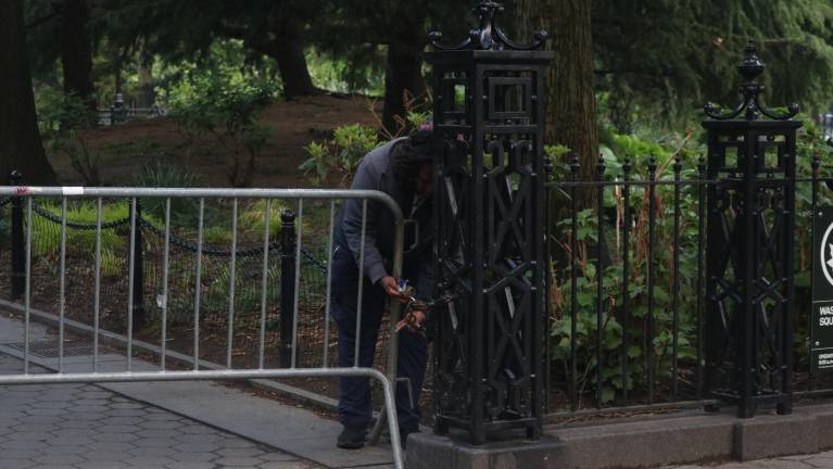 The barricades are held together by chains and locks, which the Parks Department has to lock and unlock every day.