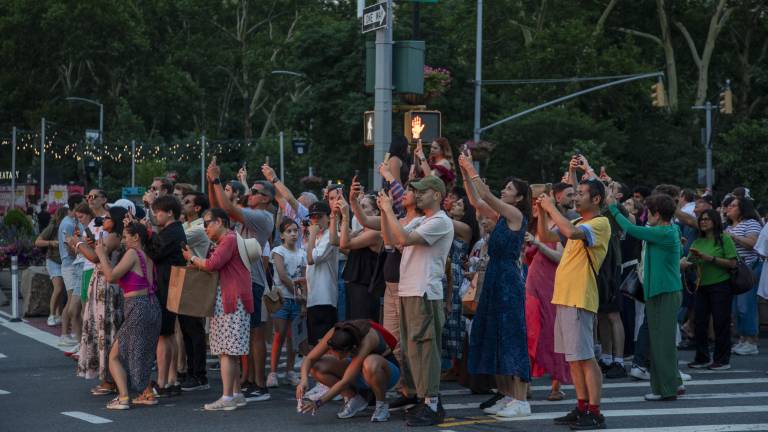 The spectacle brings together people from all over the city and all over the world, all aiming to strike the perfect picture of the striking sunset.