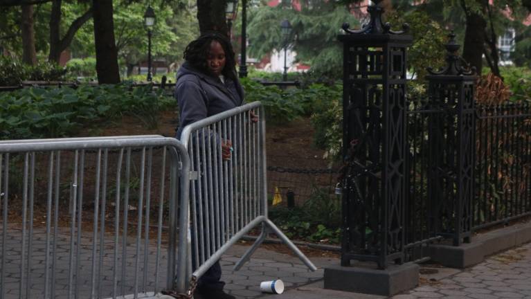 The Parks Department has to move the barricades twice a day: at midnight and 6 a.m. Some believe gates would be easier to maneuver.