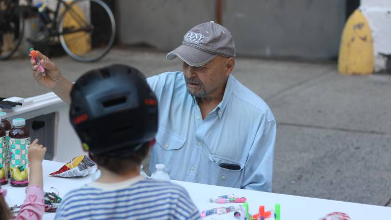 Ed, a volunteer at the event, handed out knickknacks and refreshments.