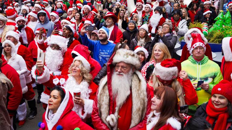 SantaCon attendees participate in the annual pub crawl in New York City on Saturday, Dec. 13, 2025.