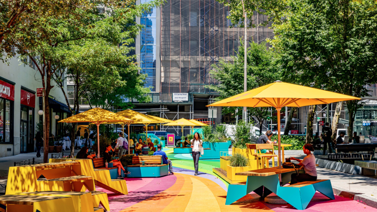 A new plaza has opened next to Spring Street Park in Hudson Square, complete with furniture and a vibrant mural. Free programming will be held at the park until October 29.