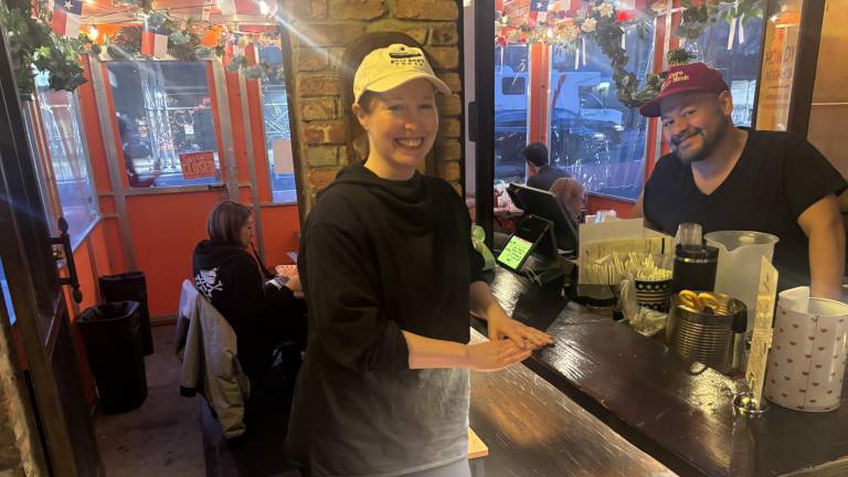 Tiffany Collings and Oscar Hernandez, two of the three co-owners of Wayne &amp; Sons. say they’ll be forced to move the popular taco place if the city forces them to tear down the small enclosed outdoor dining shed in the East Village.
