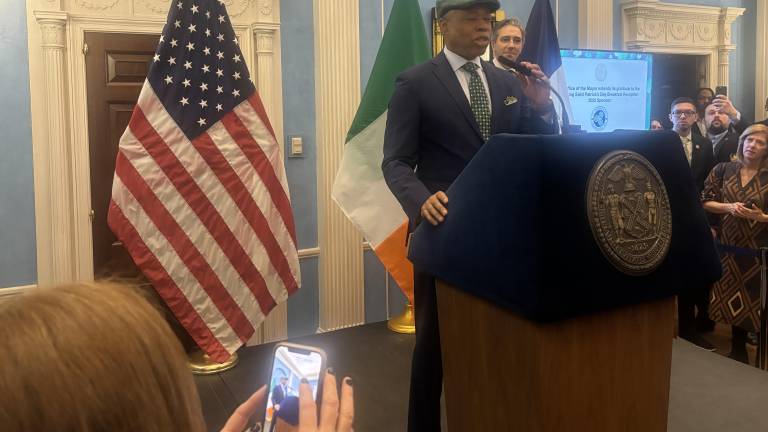 Mayor Eric Adams, wearing an Irish “scoop” cap and a green tie at the annual Gracie Mansion breakfast to start the day. But he skipped the traditional St. Patrick’s Day Mass to huddle with top aides.