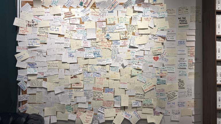 In the basement, a cork board for visitors to leave messages was filled after only four days.