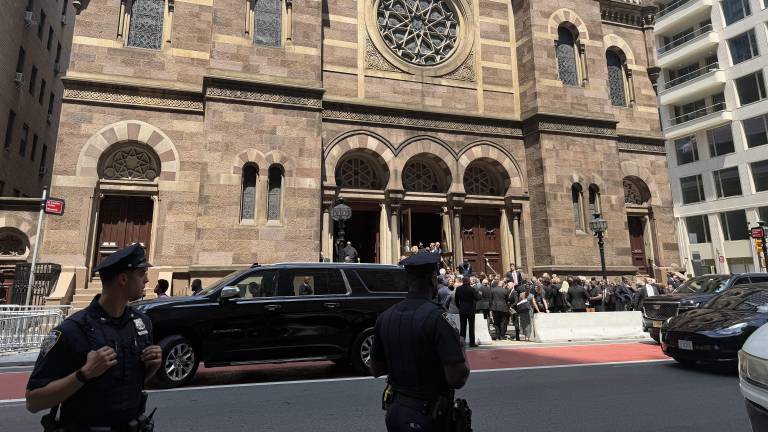 Attendees converse outside the Central Synagogue on Lexington Ave. after the star studded funeral for Clive Davis, who died last week at the age of 94. In a 66-year career, he discovered musical talent from Whitney Houston to Bruce Springsteen.