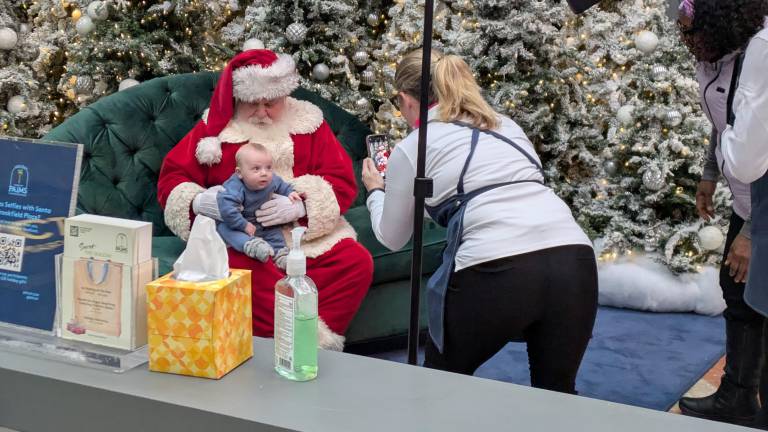 Santa Claus and baby at Brookfield Palace.