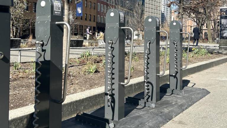 The first of five charging hubs in East Village at the corner of 6th street and Cooper Square on March 1, where up to 100 delivery drivers will be able to charge their e-bikes after signing up for the pilot program in the coming days. Photo Credit: Alessia Girardin.