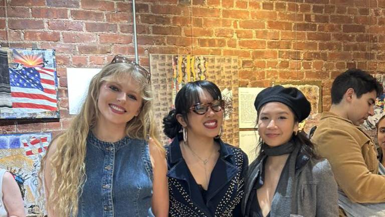 Camille (left) stands with fashion designer Kalita hon (middle), and guest Ilona Ho (right) who came to see her show at the Neighbor Gallery in Chelsea on Feb. 11