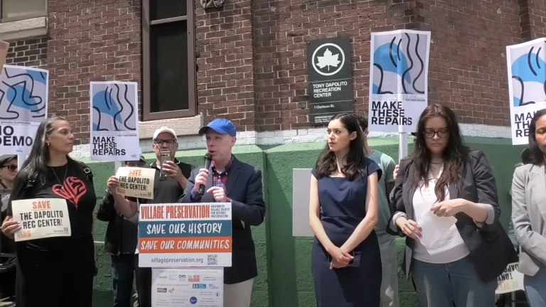Andrew Berman, head of Village Preservation, leads a June 1 rally outside the historic Tony Dapolito Recreation Center. Rallygoers hoped to convince city officials to reroute $51 million in proposed demolition-and-rebuild funds towards repairs, instead.